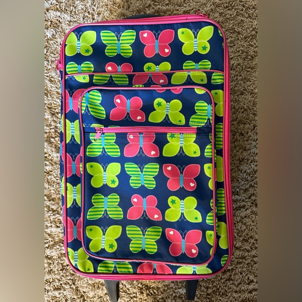 Almost new children’s suitcase and bag set in butterflies